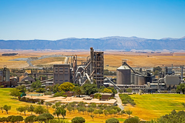 Cement factory in wide valley in Western Cape © geoffsp
