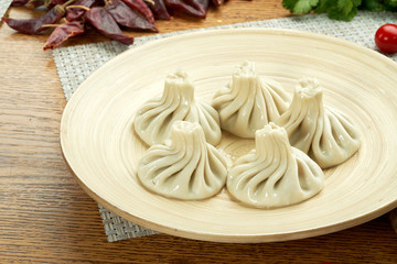 khinkali with meat on a plate on the table