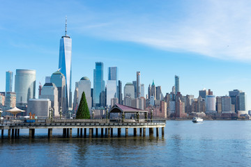 Fototapeta na wymiar Lower Manhattan New York City Skyline seen from Jersey City with a Christmas Tree