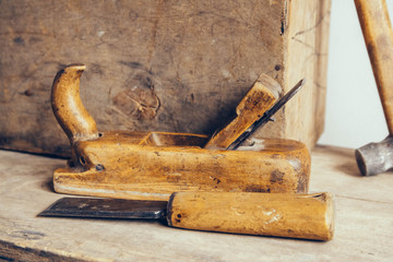 Old construction tools on a wooden workbench flat lay background. Carpenter table. Woodwork. Copy, empty space for text