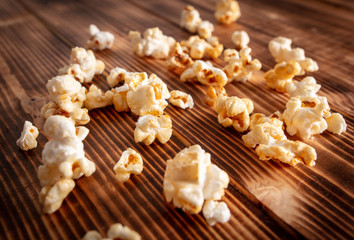 Popcorn flakes on a wooden background