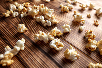 Popcorn flakes on a wooden background