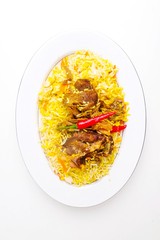 rice with meat and vegetables isolated on white