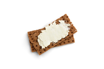 Rye crisp bread with cream cheese isolated on white background.
