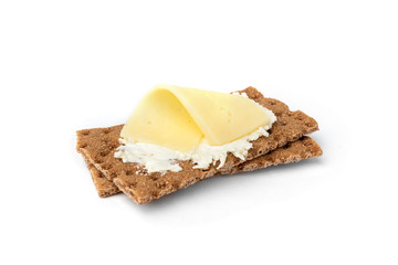 Rye crisp bread with cream cheese isolated on white background.