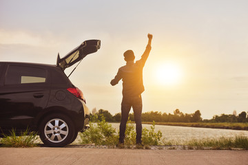 Man at car on road enjoying landscape nature