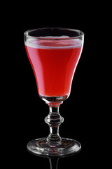 Glass of strawberry daiquiri cocktail isolated on black background