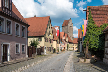 Dinkelsbühl, Germany - July 16, 2019; Half timbered houses in a street in Dinkelsbühl an touristic and historic town on the romantic road