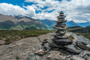 Stone mound with mountains on background