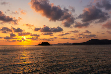Naklejka na ściany i meble Sea and sunset with beautiful cloud at twilight.