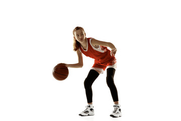 Young caucasian female basketball player in action, motion in run isolated on white background....