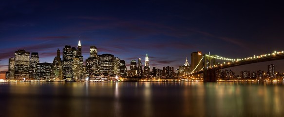 Panoramic shot of the famous Brooklyn Bridge during the nighttime in the USA