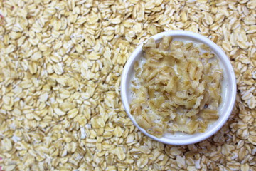 Oatmeal in milk in a small plate