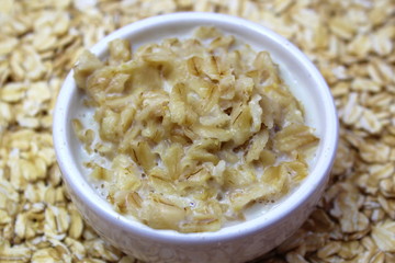 Oatmeal in milk in a small plate
