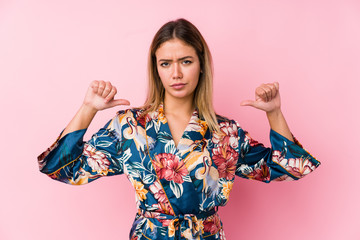 Young caucasian woman wearing pajamas feels proud and self confident, example to follow.