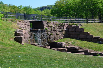 A stone wall and waterfall