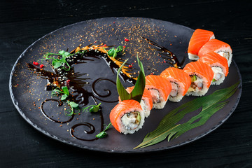beautiful japanese sushi decorated on a black plate