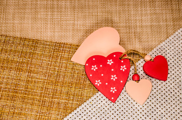 Valentine's card. Hearts on a natural linen background. Relationship between people. The concept of romance.