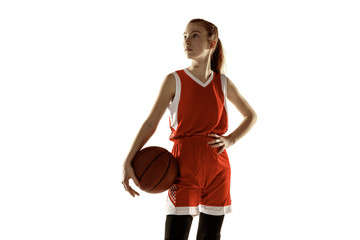 Young caucasian female basketball player posing confident isolated on white background. Redhair...