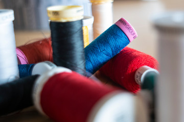 Close up colorful sewing spool full of color, colorful spools
