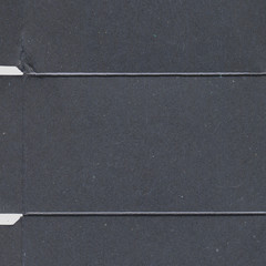 Fototapeta premium Black vintage rough sheet of carton. Recycled environmentally friendly cardboard paper texture. Simple gray minimalist papercraft background.