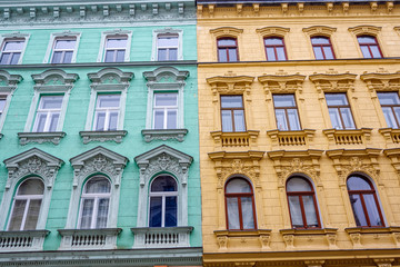 Vienna Architecture. Renovated colored facade of an old apartment building. Close up view.