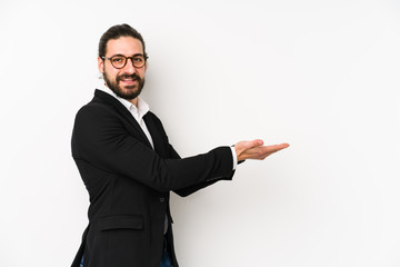 Young caucasian business man isolated on a white background holding a copy space on a palm.