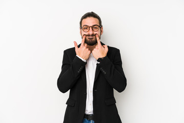 Young caucasian business man isolated on a white background doubting between two options.