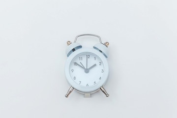 Simply flat lay design Ringing twin bell vintage classic alarm clock Isolated on white background. Rest hours time of life good morning night wake up awake concept. Flat lay top view copy space.