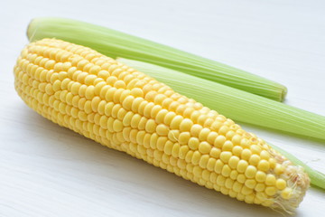  fresh organic corn in leaf, shelled and in pieces