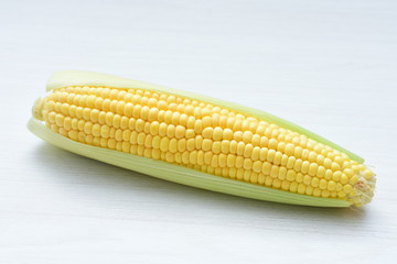  fresh organic corn in leaf, shelled and in pieces