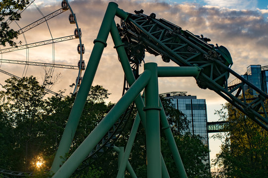 People screaming and holding up hands during roller coaster ride Helix at Liseberg amusement park Gothenburg Sweden - People having fun at their leisure.