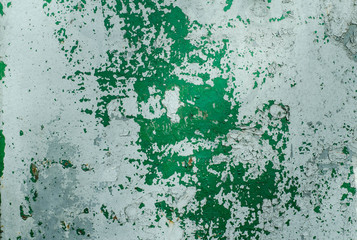 The old painted wall. The structure of the old paint. The paint is climbing off the wall. Wooden wall.