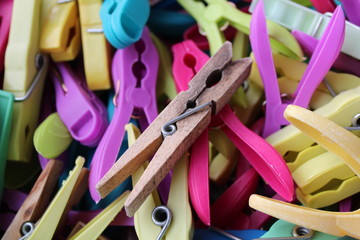 colorful clothes pegs all piled up