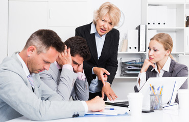 Fototapeta premium Female manager expressing dissatisfaction with teamwork