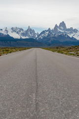 Empty road with the Mount Fitz Roy on the background. Patagonia, Argentina