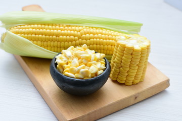  fresh organic corn in leaf, shelled and in pieces