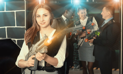 Lucky woman and her colleagues in laser tag room