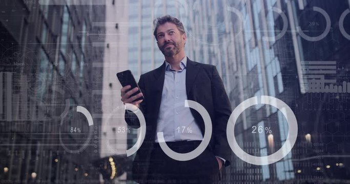 Adult Hispanic man using smart phone outside office with animation digital business graphs