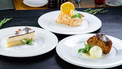 dessert set tiramisu cake, napoleon and cappuccino coffee