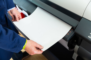 Rolling plotter printer in work