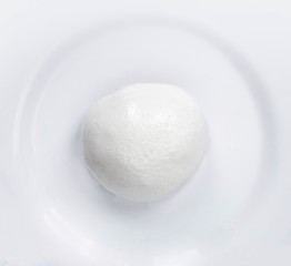 Mozzarella cheese Buffalo  isolated on a white plate. Top view. Traditional Italian Mozzarella