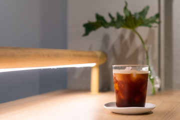 A glass of ice americano in coffee cafe