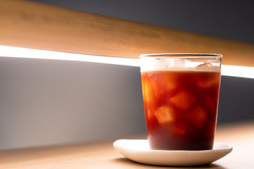 A glass of ice americano in coffee cafe