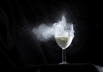 Wine Glass containing liquid shattering after being shot with Air Rifle.