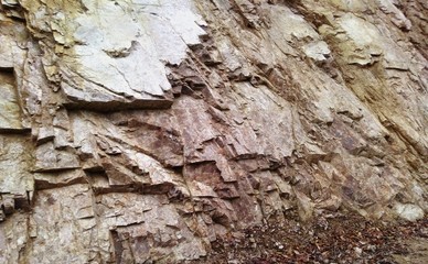 fractured granitic rocks outcrop near the road