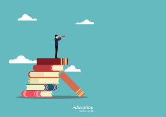 Businessman standing on book looking go to the future