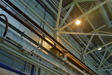 The combination of the steel beams and metal pipes in the industrial premise of the plant