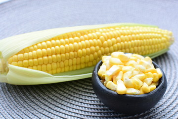  fresh organic corn in leaf, shelled and in pieces