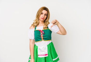 Young woman wearing a saint patricks day clothes isolated showing a dislike gesture, thumbs down. Disagreement concept.